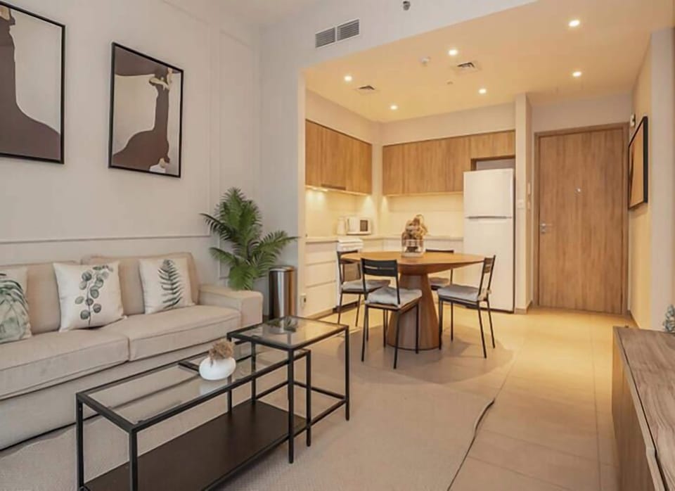 Apartment, Balcony, City View | Living area | 55-inch Smart TV with cable channels