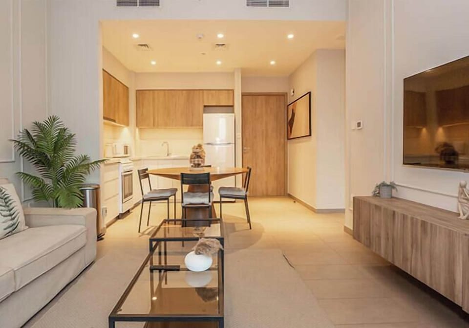 Apartment, Balcony, City View | Living area | 55-inch Smart TV with cable channels