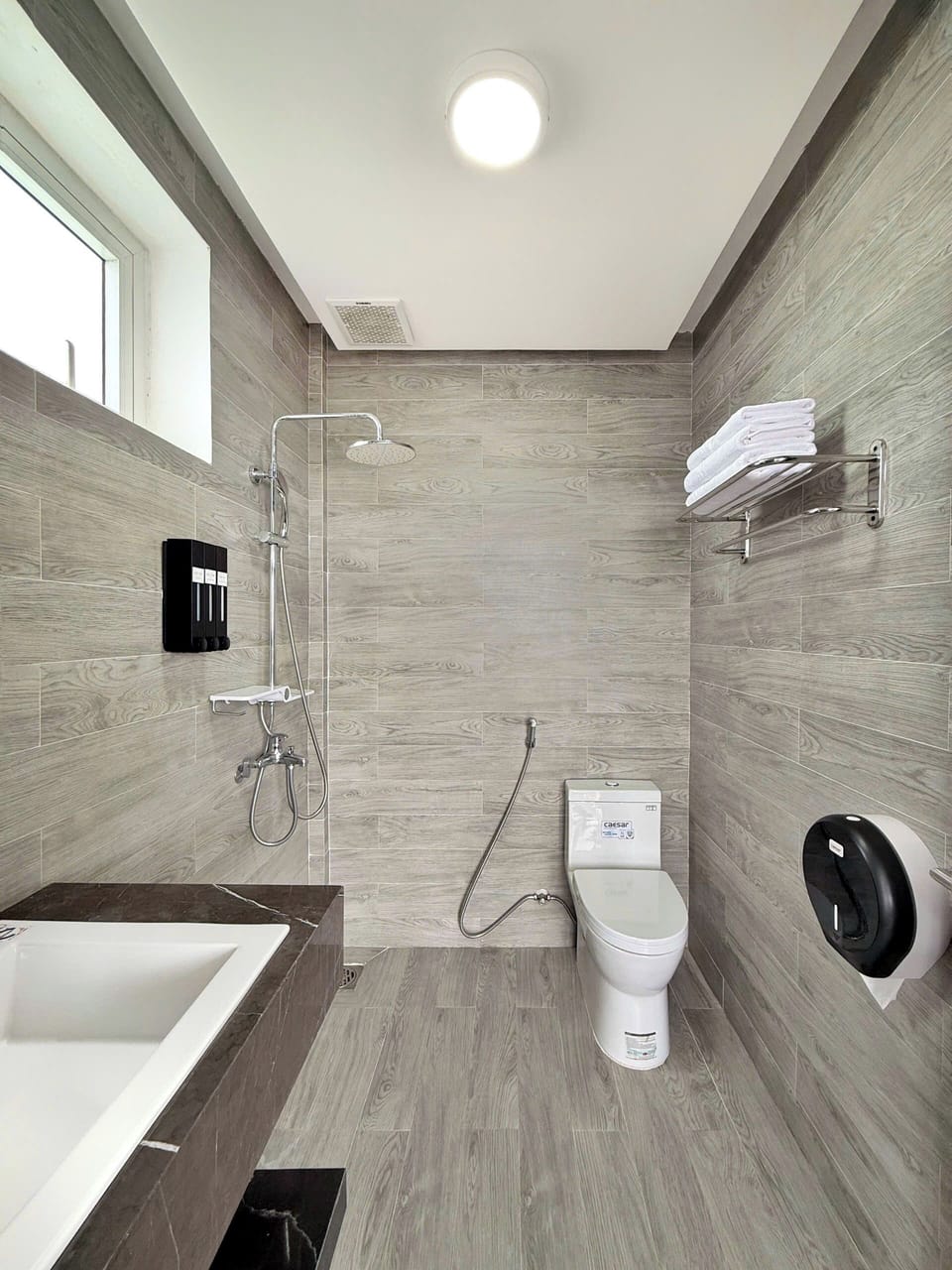 Shower, hair dryer, slippers, towels