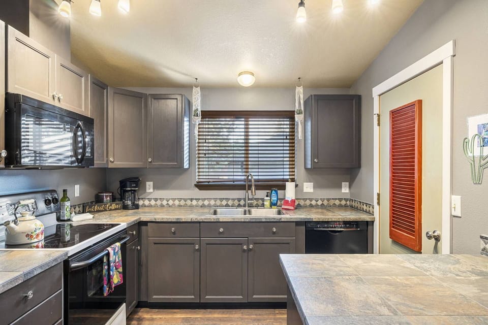 The kitchen is has plentiful counter space, up to date appliances, and is fully equipped with a wide variety of pots and pans.