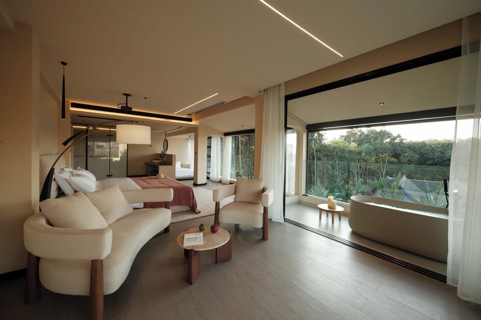 Deluxe Double Room, Patio, City View | Living area | TV