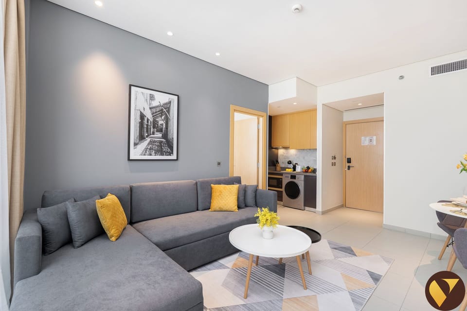 Apartment, Balcony, City View | Living area | 65-inch Smart TV with cable channels