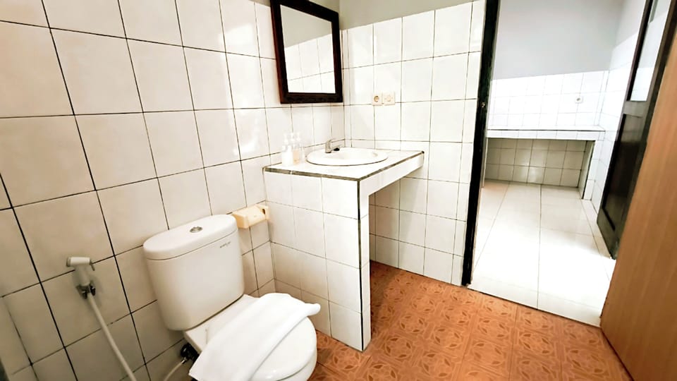 Family Triple Room, Garden View | Bathroom | Shower, hair dryer, towels, soap