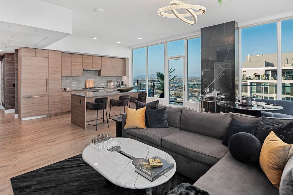 Open-plan kitchen and living area, showing a modern kitchen island.