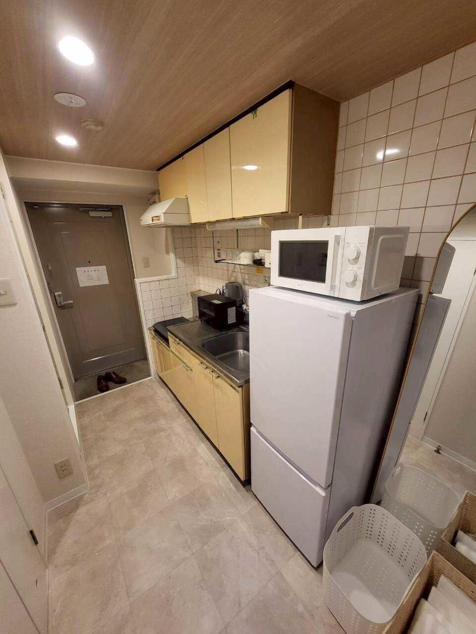 Apartment | Private kitchen | Full-size fridge, microwave, oven, stovetop