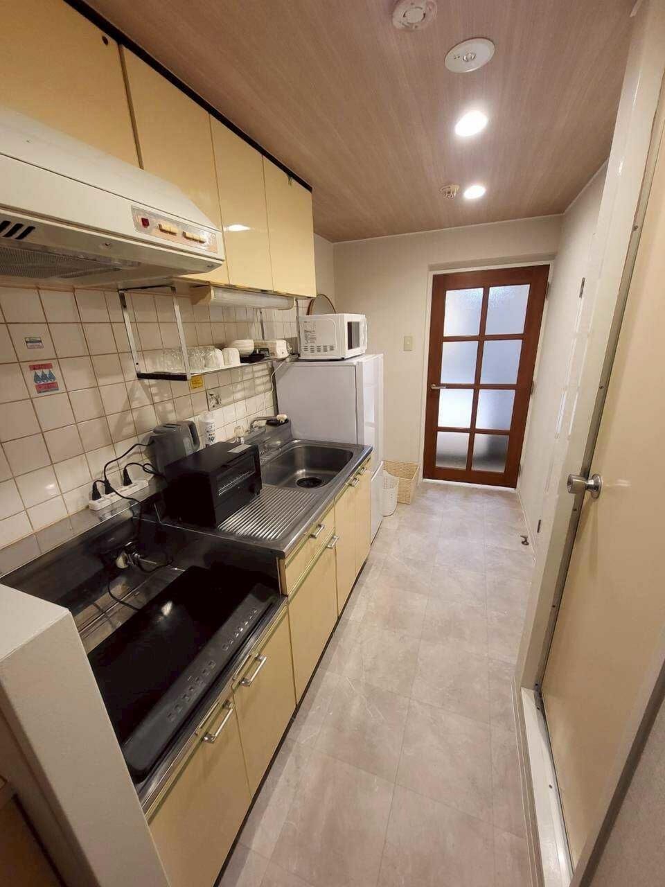 Apartment | Private kitchen | Full-size fridge, microwave, oven, stovetop