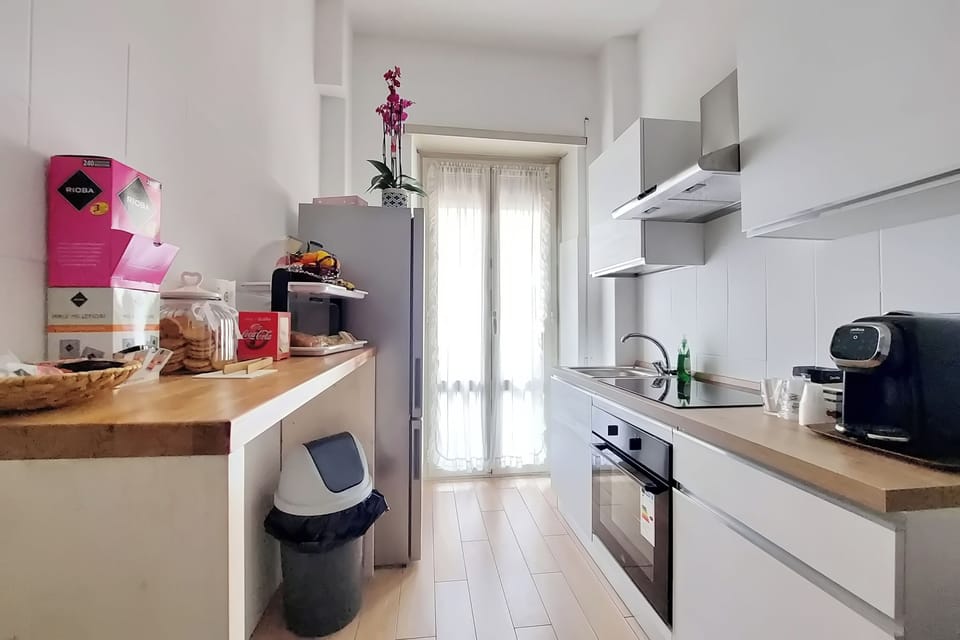 Mini-fridge, oven, stovetop, cookware/dishes/utensils