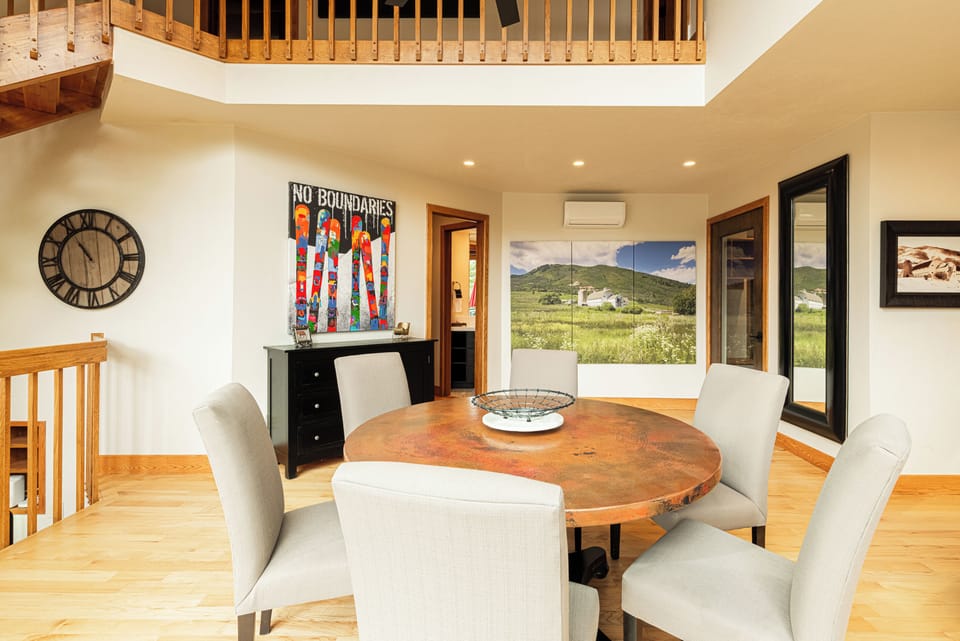 Dining table with beautiful art.