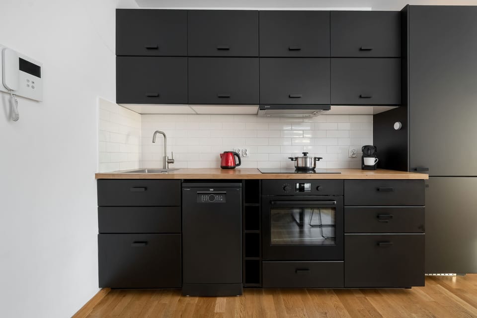 The kitchen's modern amenities ensure a comfortable stay.