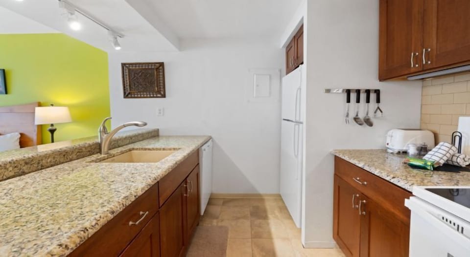 Enjoy the inviting ambiance of the kitchen area, where ample counter space invites you to prepare delightful meals.
