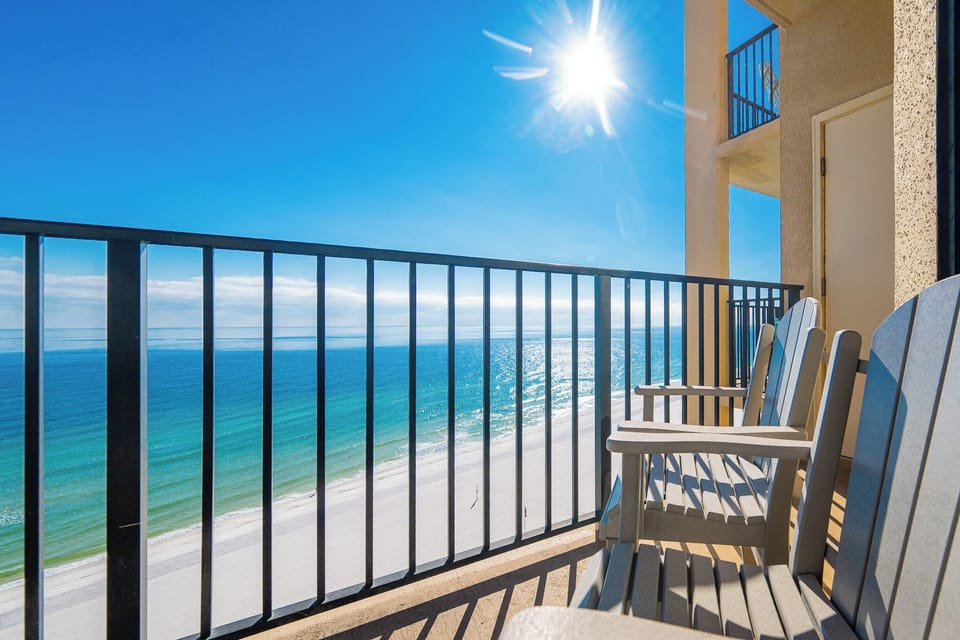 Sunlight warms your beach front balcony as you relax in chairs listening to waves below