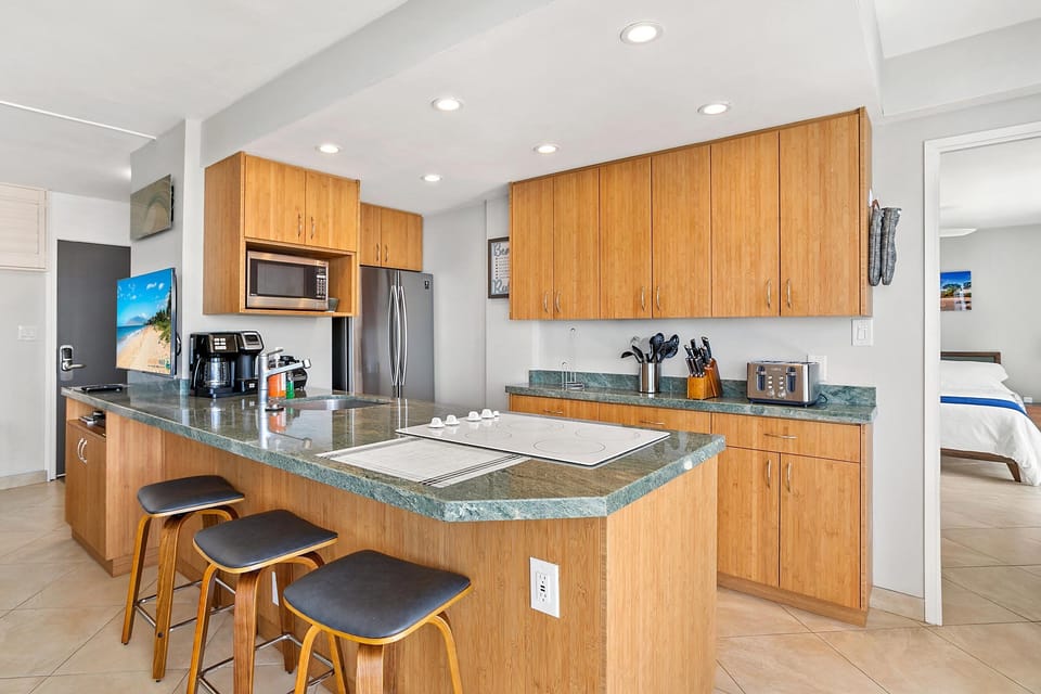 Condo, Multiple Beds, Balcony, Ocean View (Kamaole Nalu 305) | Private kitchen | Coffee/tea maker, dining tables