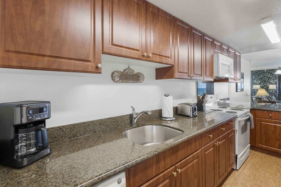 Condo, Multiple Beds, Balcony, Ocean View (Lauloa 410) | Private kitchen | Coffee/tea maker, dining tables