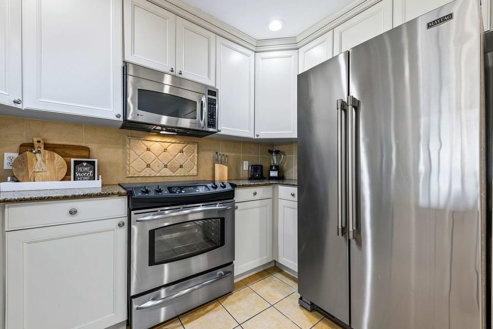 Stylish kitchen with stainless-steel appliances and plenty of counter space.