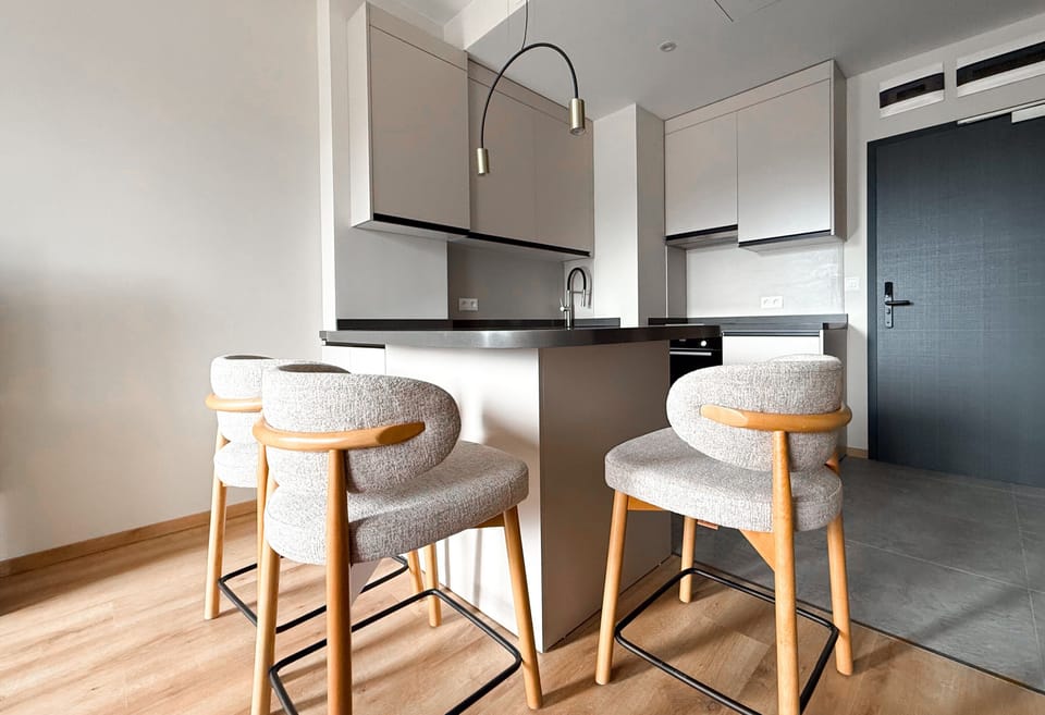 Standard Apartment | Living area | 55-inch TV with digital channels