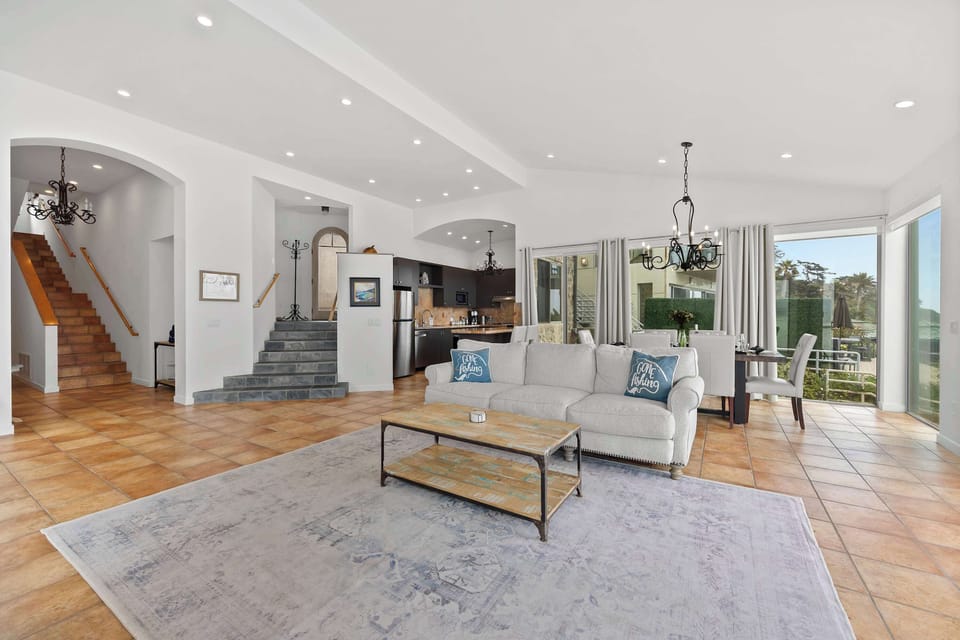 Open-Plan Living & Dining — Tile Floors, Grand Staircase & Kitchen Flow