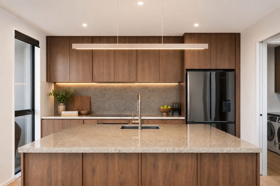 A chef`s dream. Warm walnut cabinetry, stone benchtops, and every appliance you need to cook up a feast after a day on the slopes.