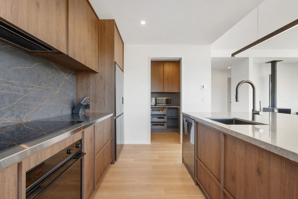The second fully equipped kitchen means large groups can spread out and cook comfortably. Perfect for multi-family Wānaka stays.