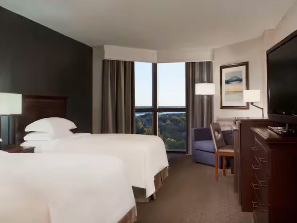 Wake to skyline views and sink into plush, cloudlike bedding.