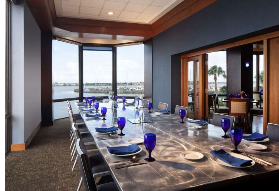 Host memorable dinners around a gleaming table overlooking the bay.