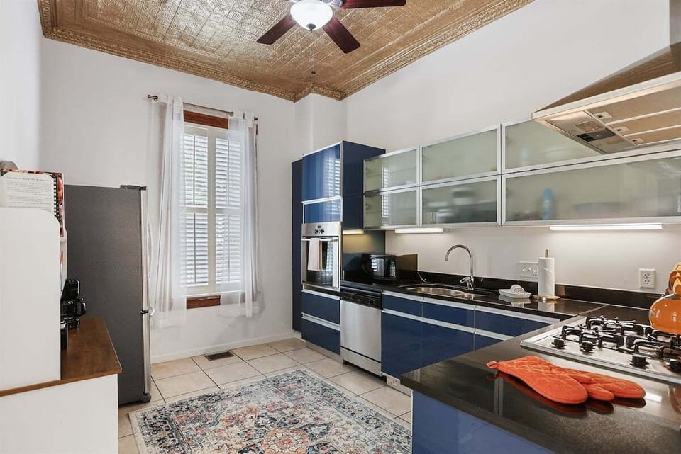 Charming tin ceiling that adds a touch of vintage elegance to this historic beauty.