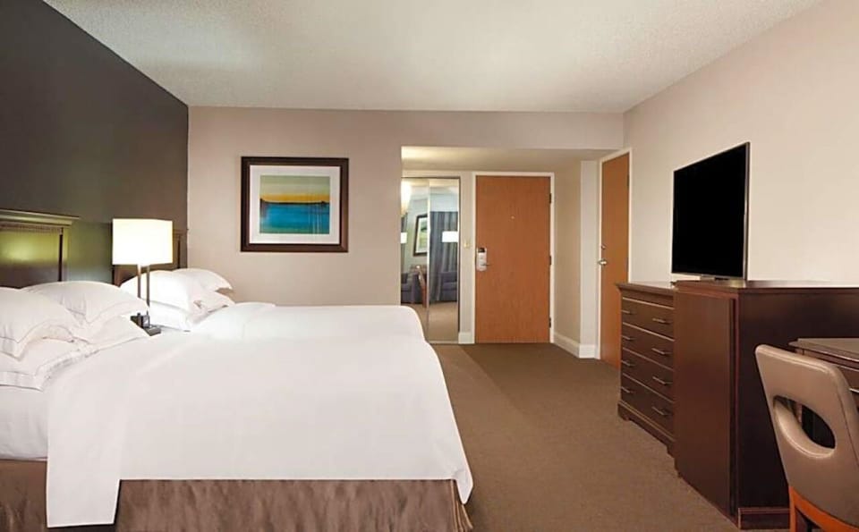 Recharge on crisp double beds in a calm, spacious room.