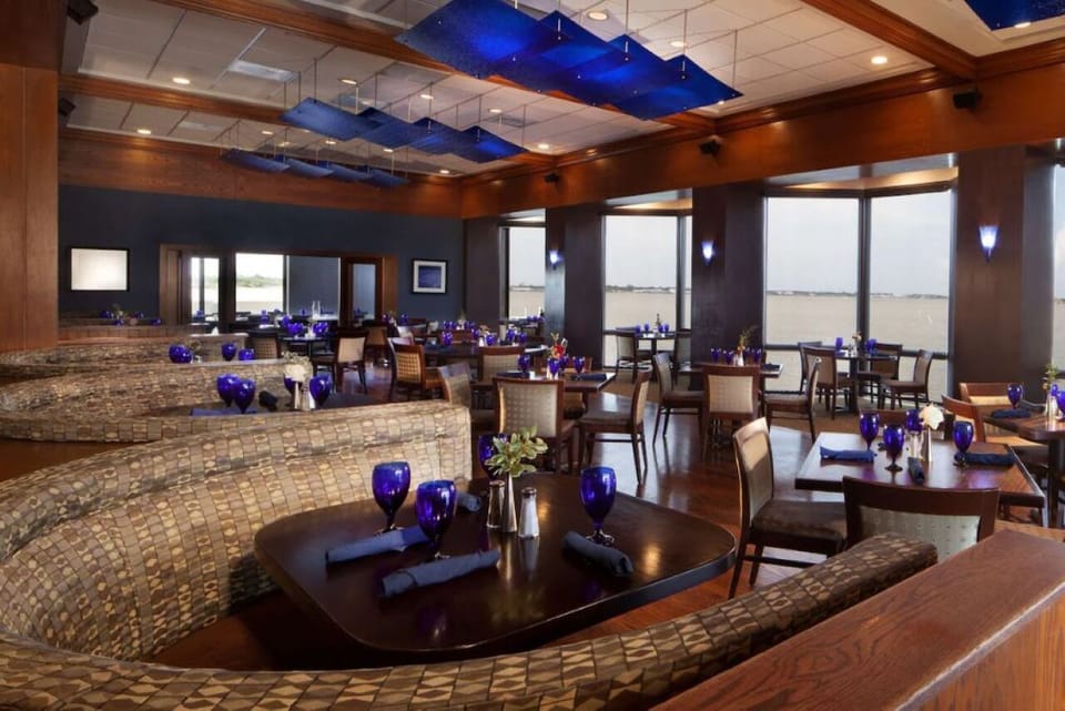 Savor relaxed conversations in a stylish dining room with views.