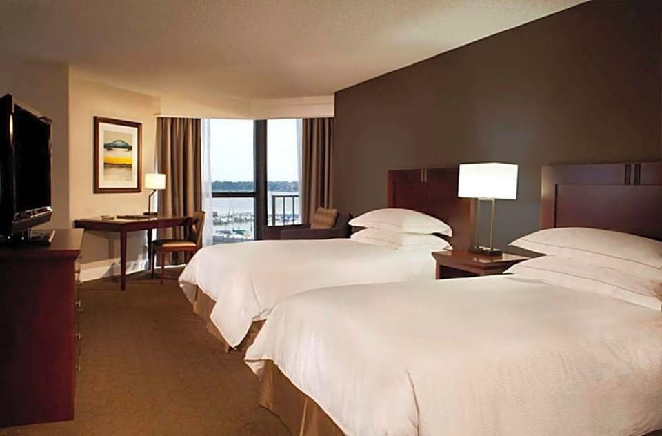 Unwind in airy double-queen comfort with sweeping water views.