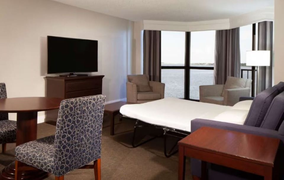 Stretch out in the spacious suite with panoramic water scenery.