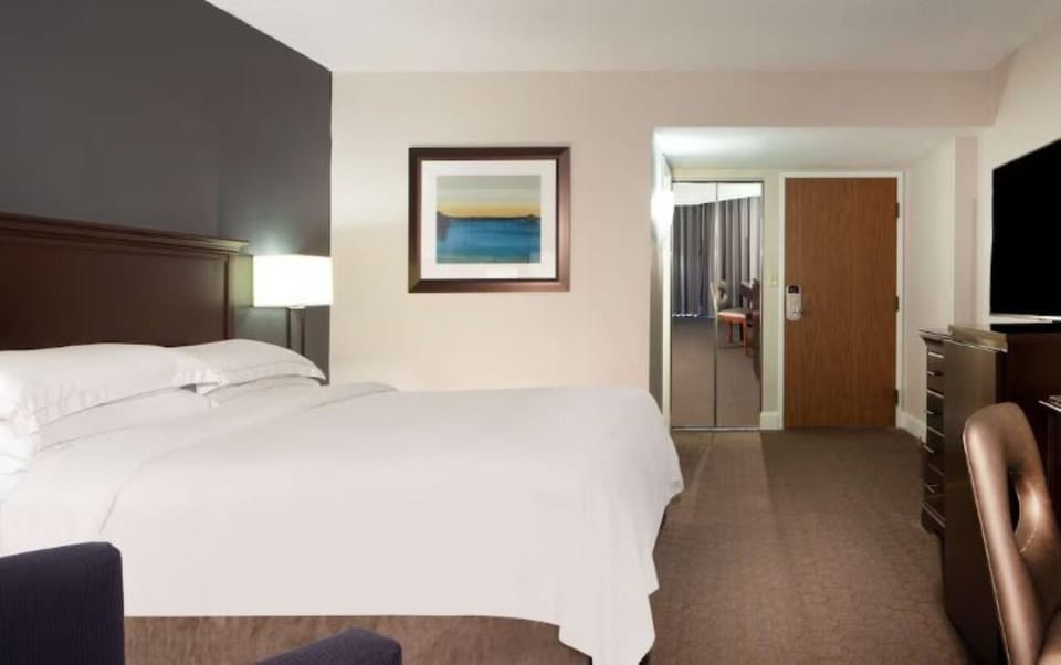 Unwind into crisp linens after a long day of exploring.