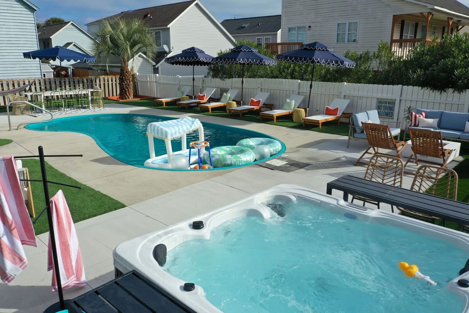 Soak into pure relaxation as the heated pool sparkles beside a bubbling hot tub—your private retreat for sun-soaked afternoons, twilight conversations, and unforgettable memories under Myrtle Beach skies.