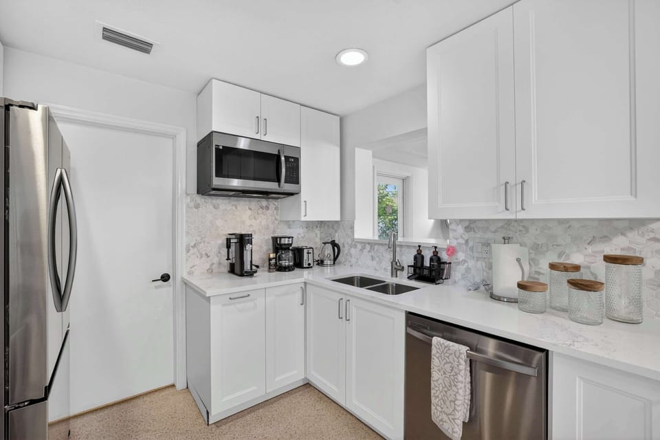 Well-appointed kitchen offering everything needed for short or extended stays, including full-size appliances.