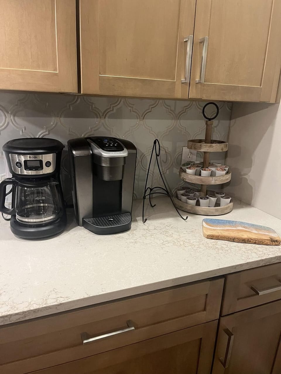 Cozy kitchen nook with modern coffee station and ample storage