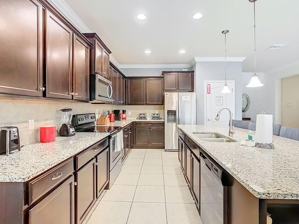 Double-sink vanity with granite countertops and plenty of mirrors.