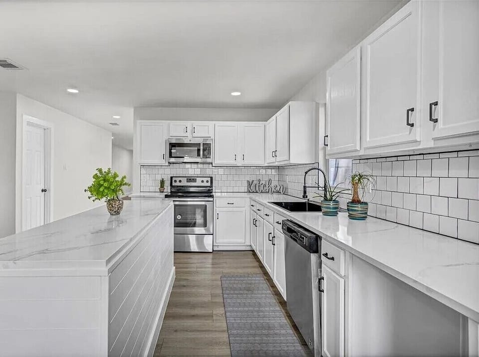 Modern, spacious, and clean kitchen designed for comfortable meal prep.