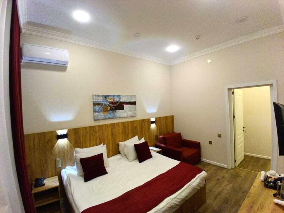 Family Double Room, Balcony, City View | In-room safe, desk, laptop workspace, blackout drapes
