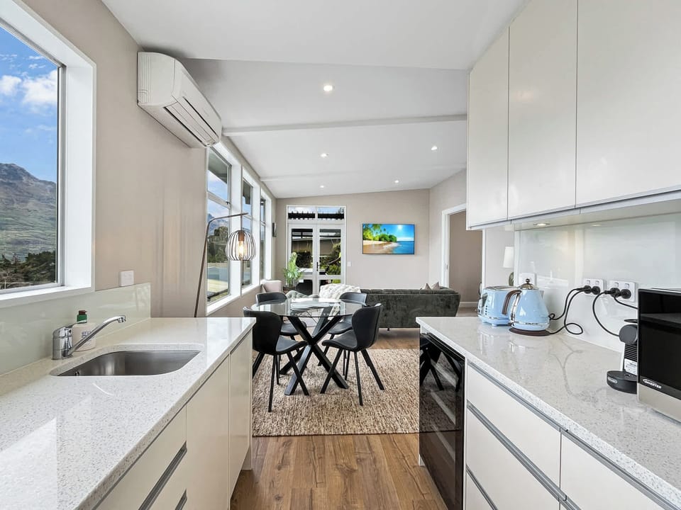 Bright kitchen flowing into open living space