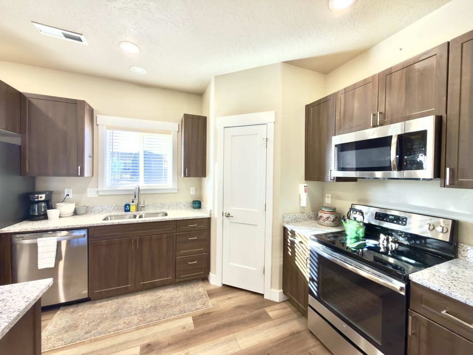 The kitchen is fully stocked with appliances and makes cooking up your favorite family meals a breeze.