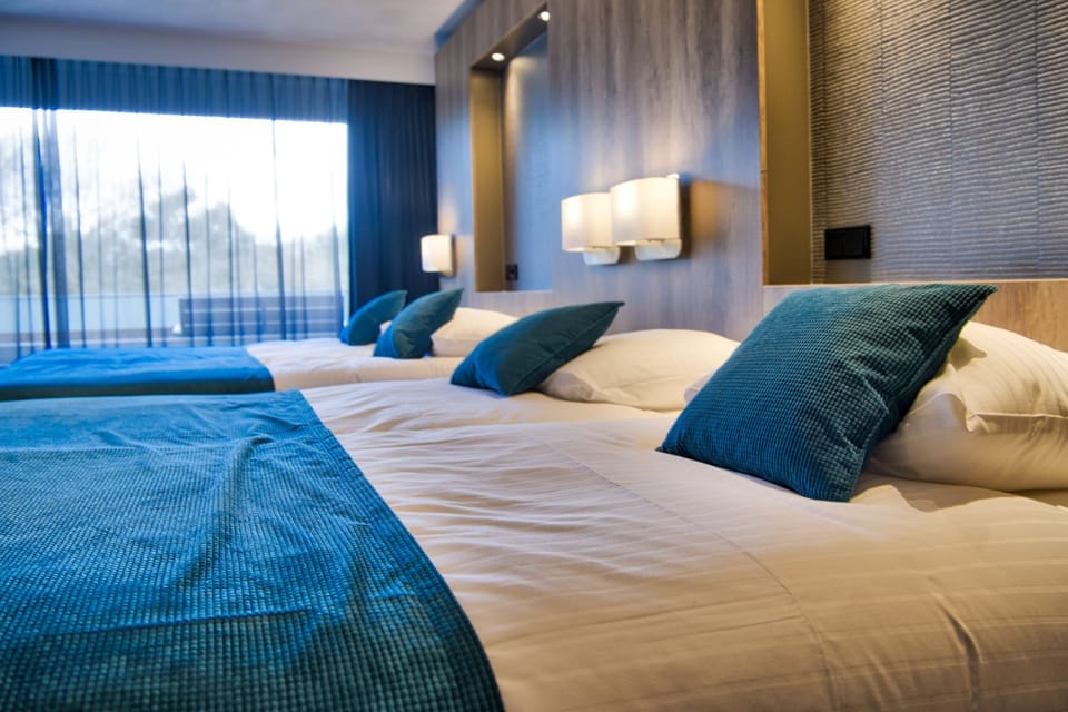 Quadruple Room, Balcony | Pillowtop beds, in-room safe, desk, laptop workspace
