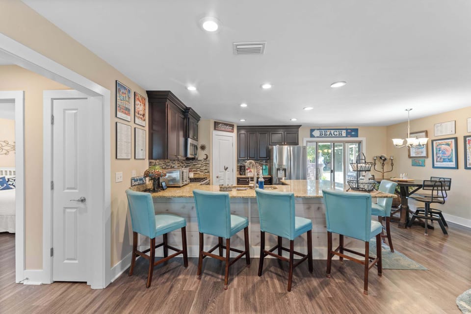 Large kitchen that's fully stocked.  Perfect for cooking a home cooked meal.  Plenty of seating around the large counter for everyone to gather.