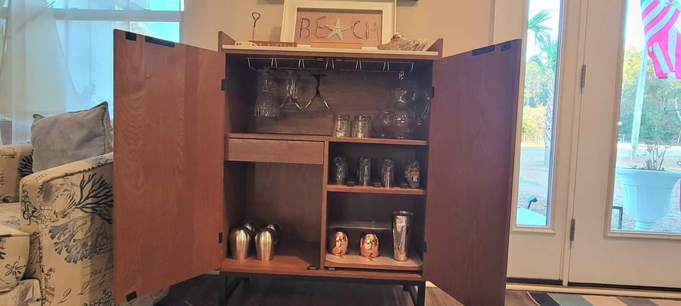 Beverage station with wine glasses, cocktail tools and everything you need for a relaxing night in
