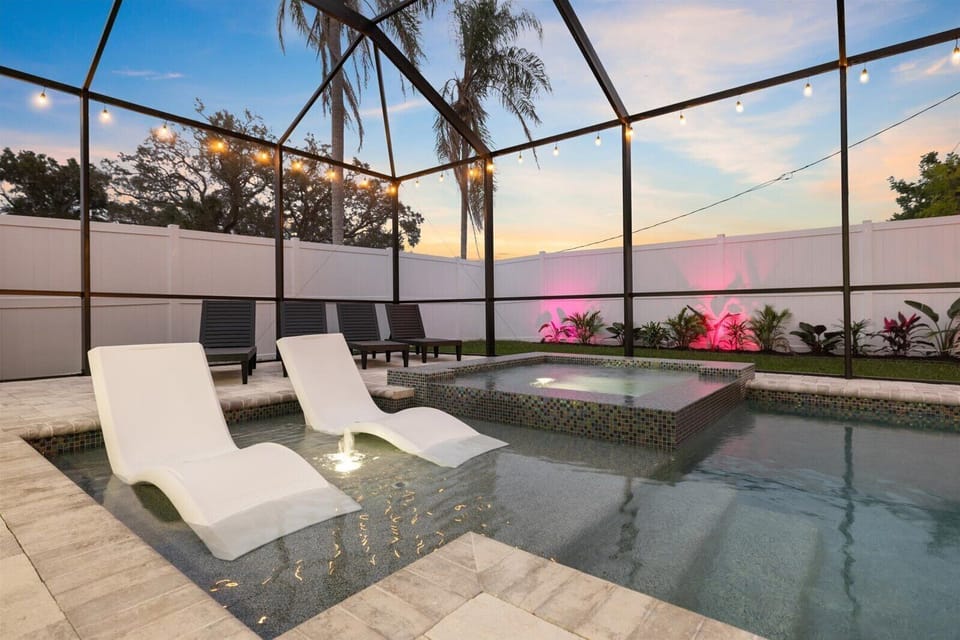 Relaxing hot tub plus premium pool and deck loungers for soaking up the sun.