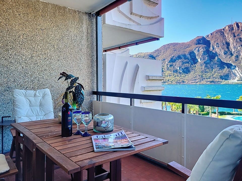 Mountainous Landforms, Mountain, Furniture, Hill, Mountain Range, Balcony, Sea, Apartment, Chair, Coast