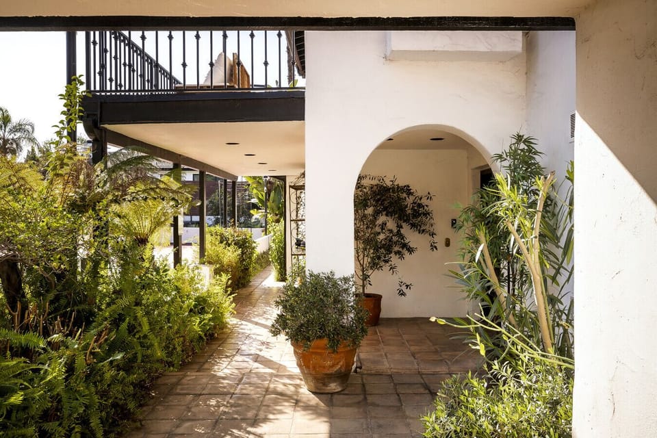 Welcome to your cozy escape. Step through the patio and enjoy a leafy, peaceful retreat.