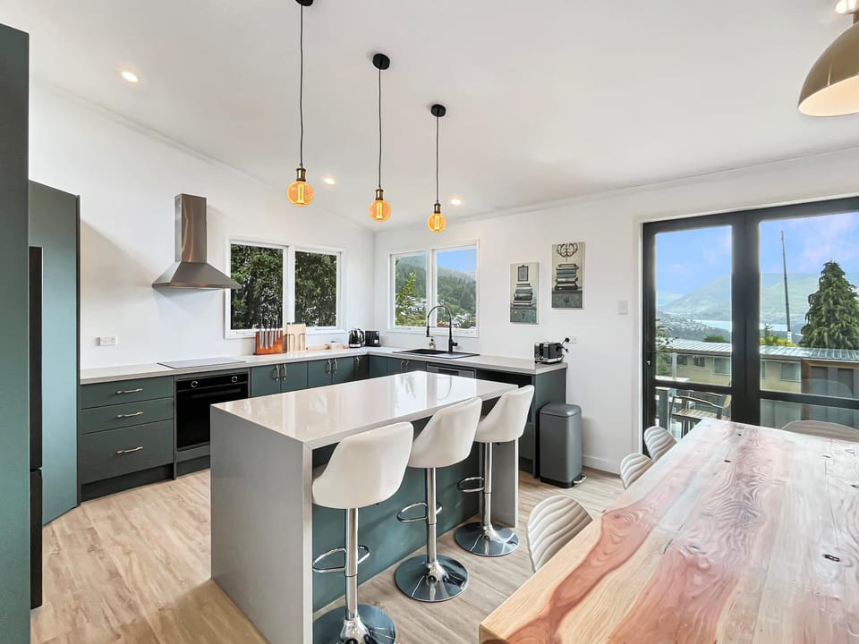 Light-filled designer kitchen with island seating