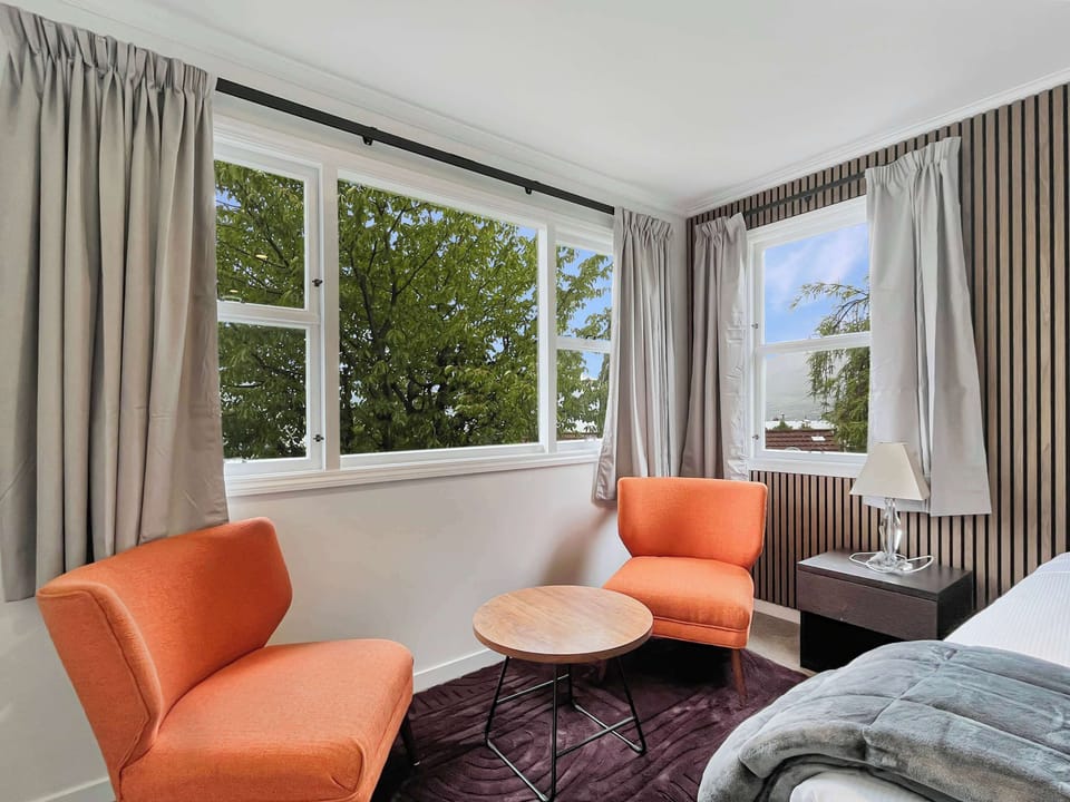 Bright bedroom with comfortable seating nook