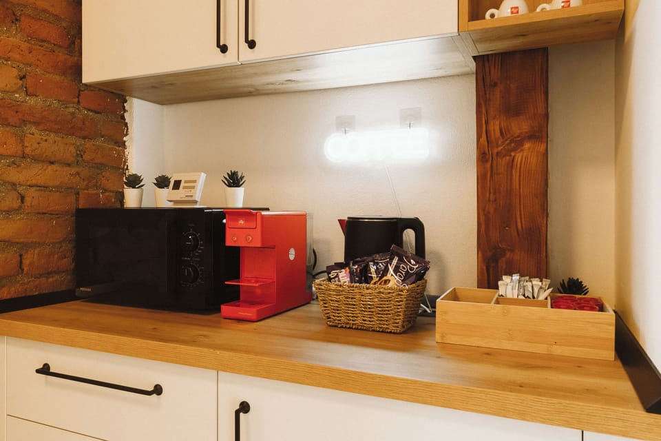 Double Room, Courtyard View | Private kitchen | Espresso maker, coffee/tea maker, mini-fridge, microwave