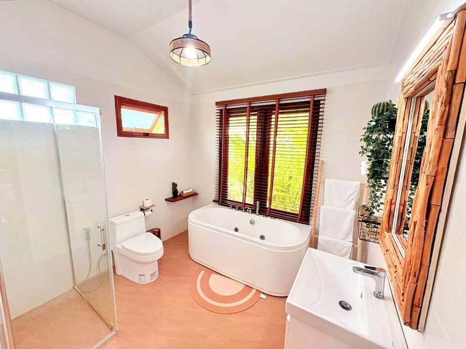 Baan Sook Jai | Bathroom | Shower, hair dryer, slippers, towels