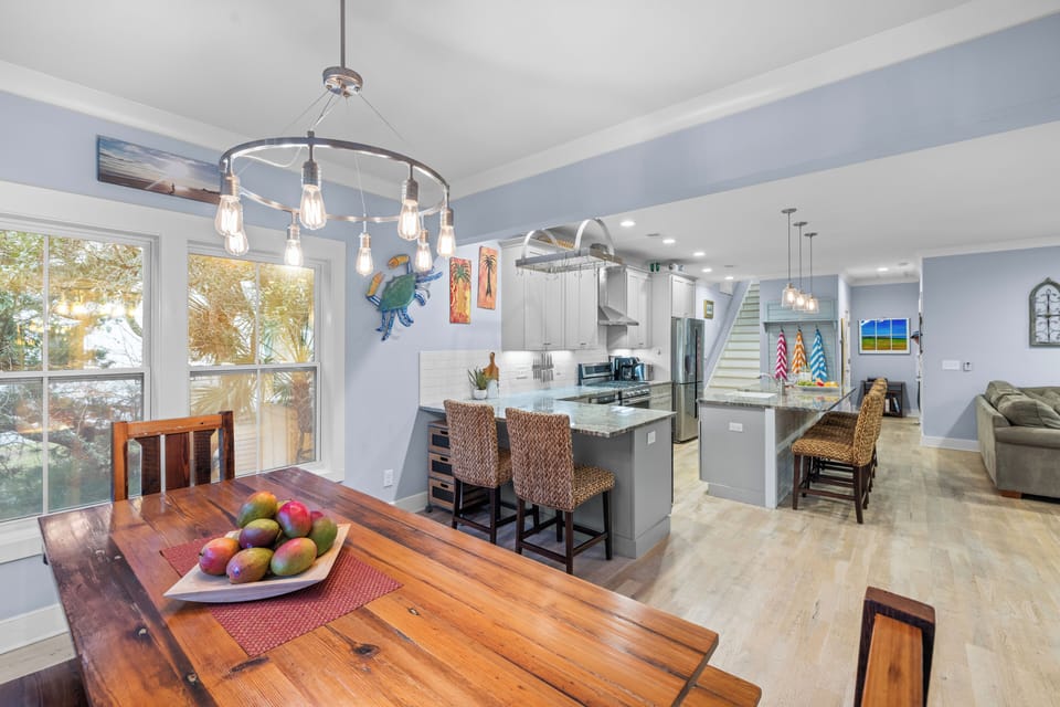 Kitchen island and dining area, highlighting the modern fixtures.