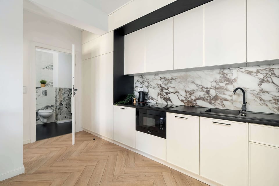 Functional kitchen wall with modern cabinetry and integrated appliances.